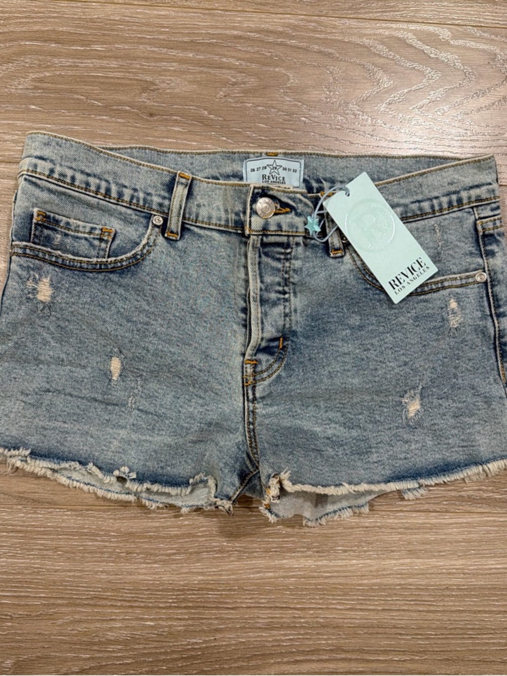 REVICE Light Wash Distressed Denim Cutoff Shorts